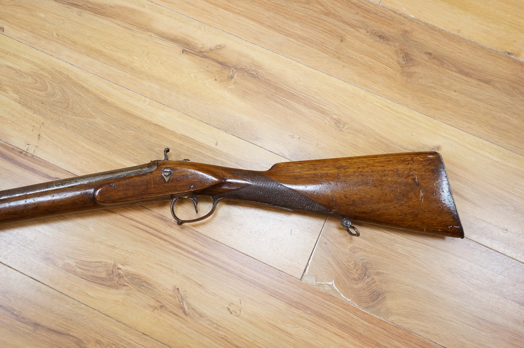 A Continental single barrel percussion sporting gun, barrel 106cm, half stocked with iron mounts and chequered grip